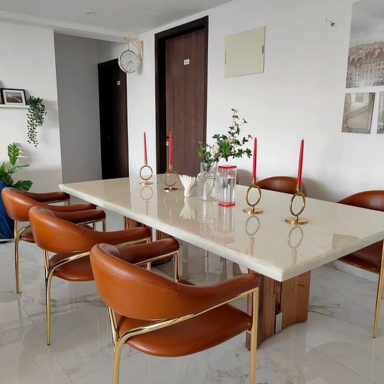 Dining Table | a modern dining table and chair set in the living room area at Maxxvalue Hotel, Chitranjan Tower, Powai